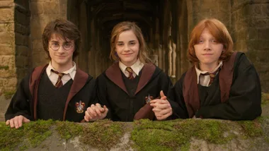 Harry Potter, Hermione and Ron from the Harry Potter Series smiling.