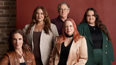 Dr Tessa Boyd-Caines, Ashlee Donohue, Dr Vincent Hurley, Annabel Daniel OAM and Sarah Williams in a group shot in front of a dark red background