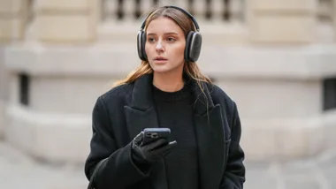 Girl wears apple airpod headphones